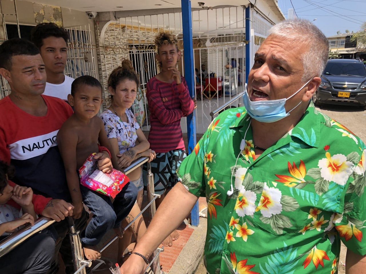 Cristian, a Colombian, here translates as Julio, a refugee, explains why he left his home in Venezuela (Larry Alex Taunton) spectator.org