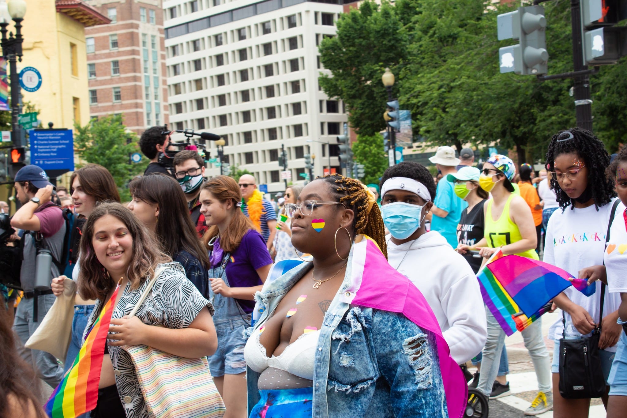 A woman is decked out in stickers with pansexual pride colors at Capital Pride on June 12, 2021 (The American Spectator)