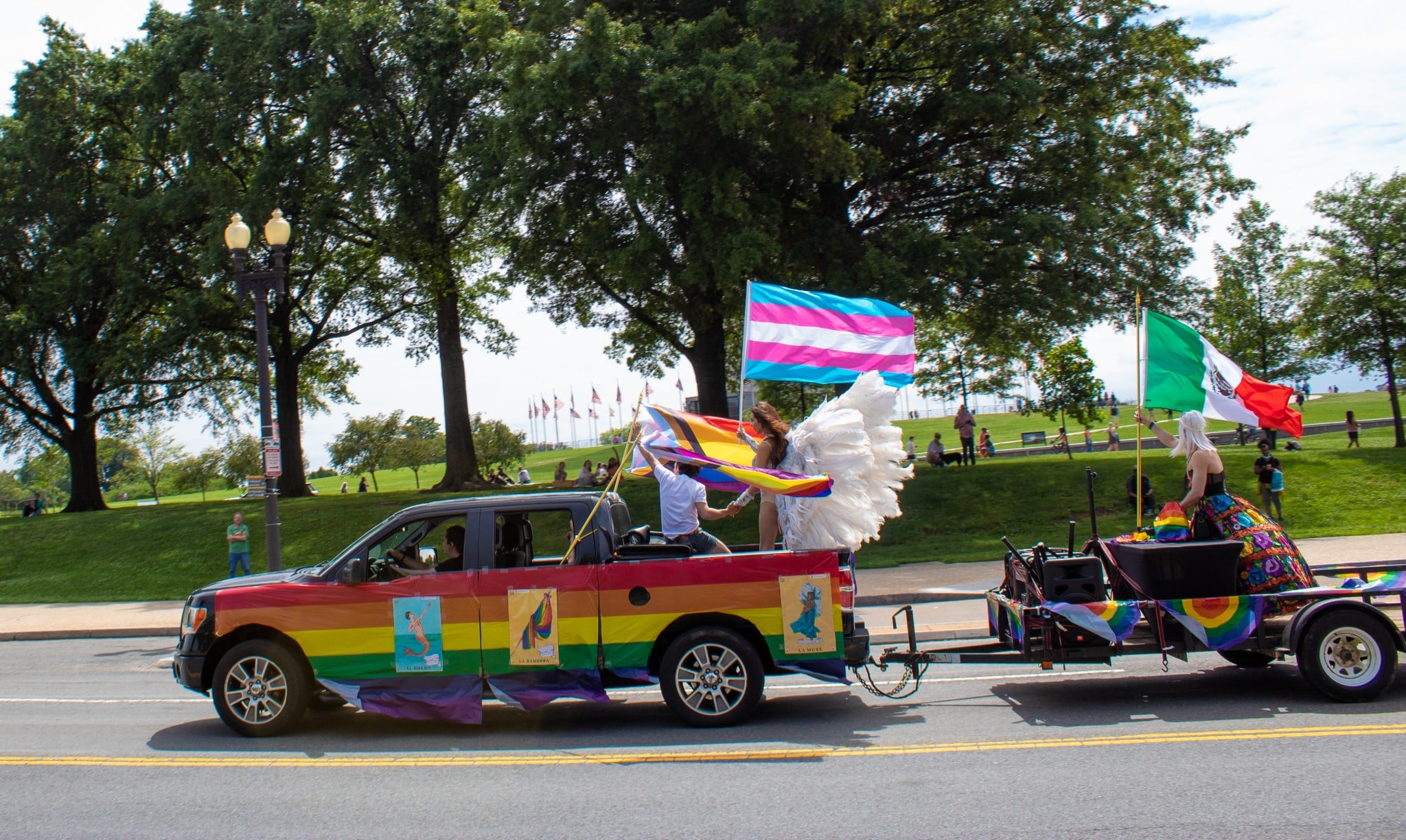 Capital Pride’s Pridemobile Parade passes by the Washington Monument on June 12, 2021 (The American Spectator)