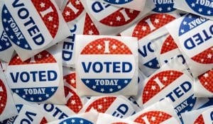 Voting stickers, illustrating piece on illegal aliens potentially voting (rfranca/Shutterstock.com) spectator.org