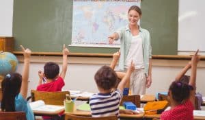 Teacher in classroom, illustrating piece on critical race theory in K-12 schools (ESB Professional/Shutterstock.com) spectator.org