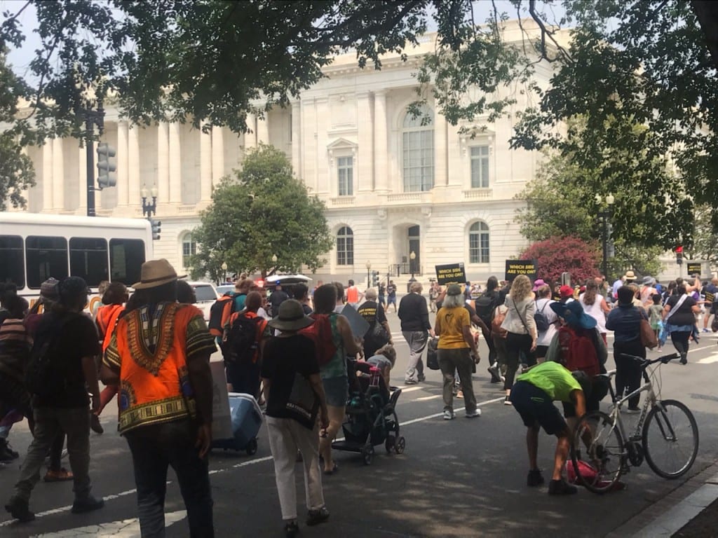 Protesters chant outside Senate office buildings on July 19, 2021 (Caelan Elliott) spectator.org
