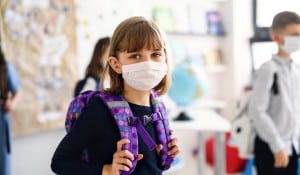 Child with mask. Halfpoint/Shutterstock