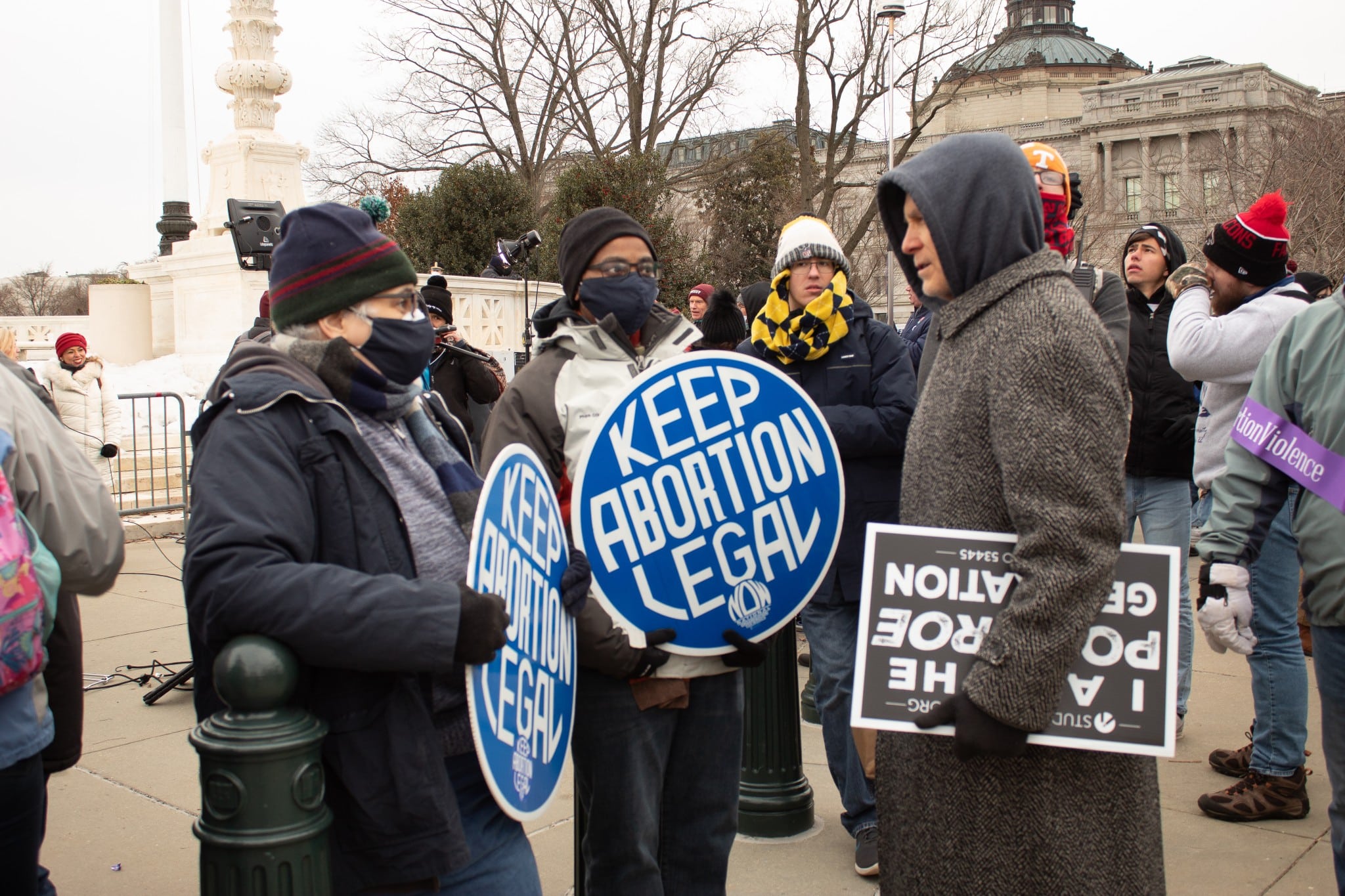 Two pro-choice counter-protesters engage with a pro-life marcher at the annual March for Life on January 21, 2022. (The American Spectator)
