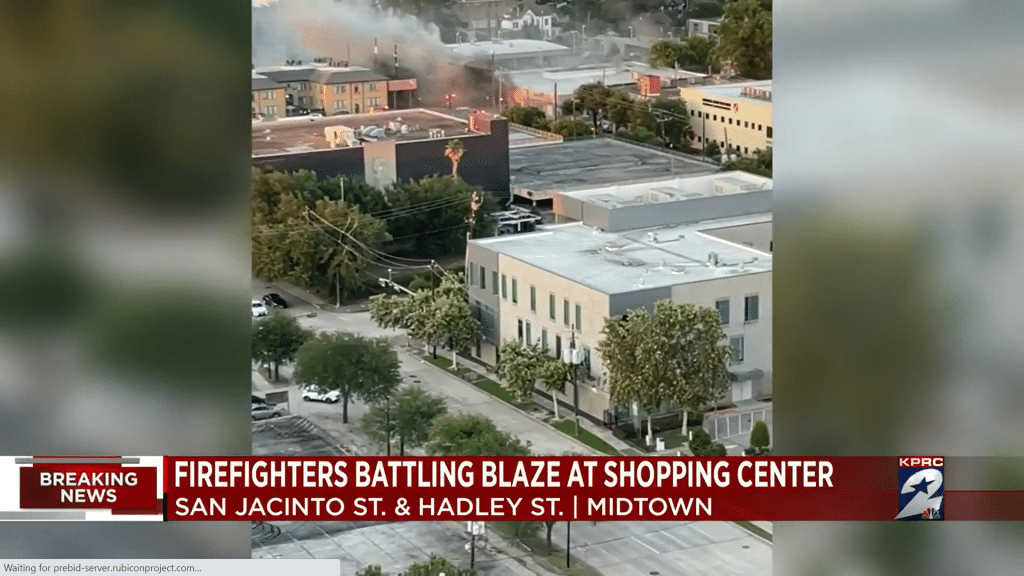Firefighters respond to the blaze at the Sacco Company Catholic Bookstore on June 25, 2022.