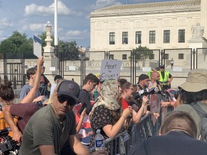 Pro-life members chanting “not your body, not your choice,” “thank you Thomas,” and “pro-choice is a lie” as pro-abortion demonstrators yell explicit messages towards them (Hunter Oswald/ The American Spectator)