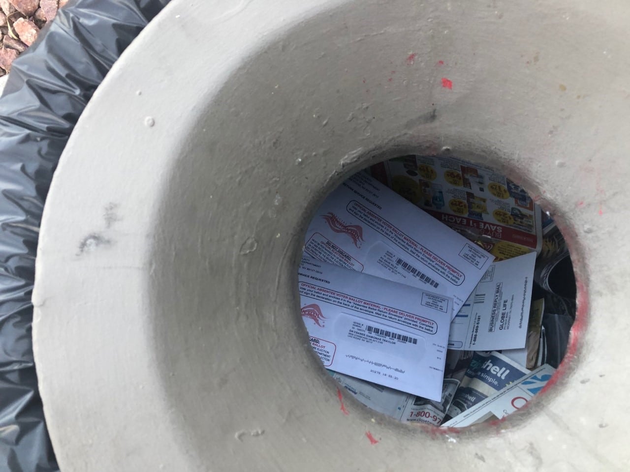 Mass mail-in ballots fester atop junk mail in a Las Vegas apartment building’s trash can, October 2020. Photo courtesy of Jim Murphy.