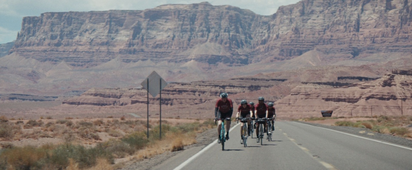 ‘Hard Miles’ cyclists with rock formations in background (Pense Productions)
